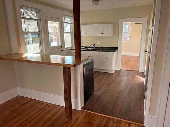 View from living room to kitchen and back bedroom.