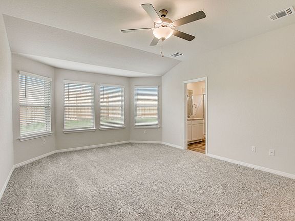 Get plenty of natural lighting in the primary bedroom.