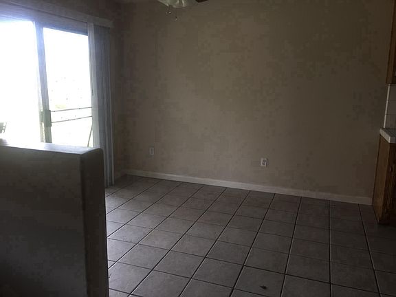 Dinning room with glass door to backyard.