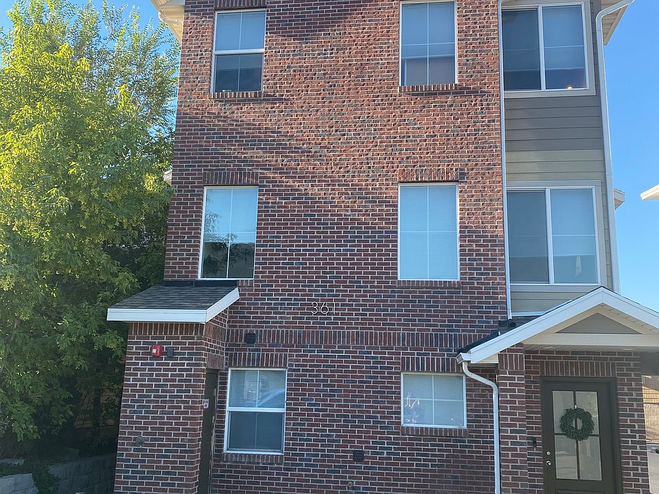 Handsome brick and Hardy exterior. This is the front. Your unit is away from the street.