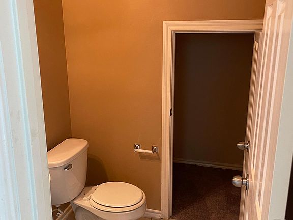 1st floor half bath with storage closet inside