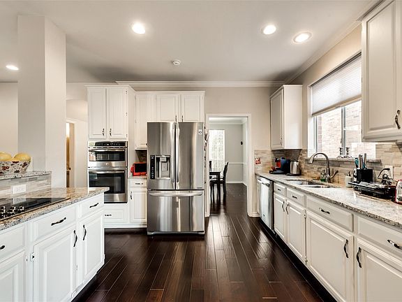 Big kitchen with a lot of counter space and SS appliance -fridge come with the house.