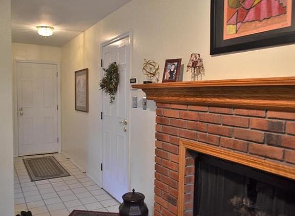 Entry foyer with door on the right leading to garage