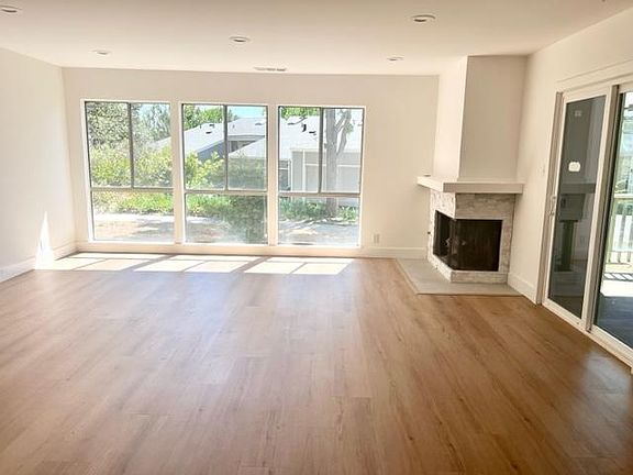 spacious living room, gas fireplace with lots of natural light