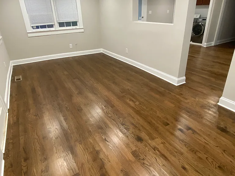 Picture of Living Room. Large enough for two sitting areas. One to watch TV with couch and chair and another for either home office or seperate sitting & dinning area.