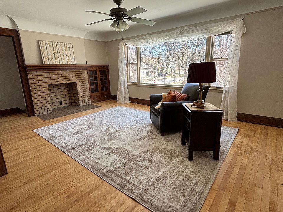 Living room with faux fireplace.