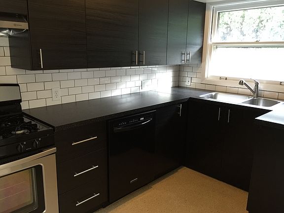 kitchen redone, with new tile countertops and appliances rec