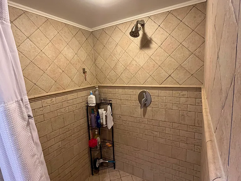 Large Italian-tiled shower in 2nd floor bath.