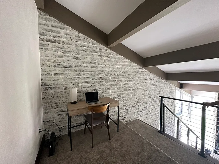 Loft area with desk.