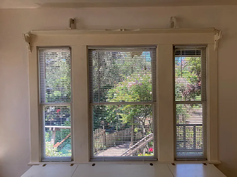 Dining room windows with built in bench storage.