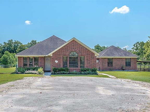 This view shows the covered garage to the right, with its own private entrance. Keep viewing the pictures for more details!