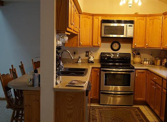 kitchen w/ corian & stainless appliances