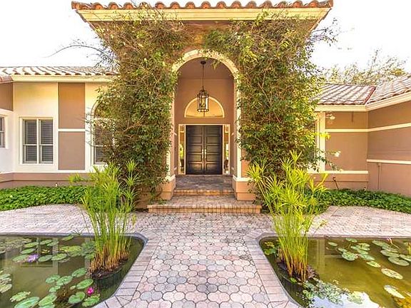 Coral Gables estate nestled on charming Old Cutler Rd.