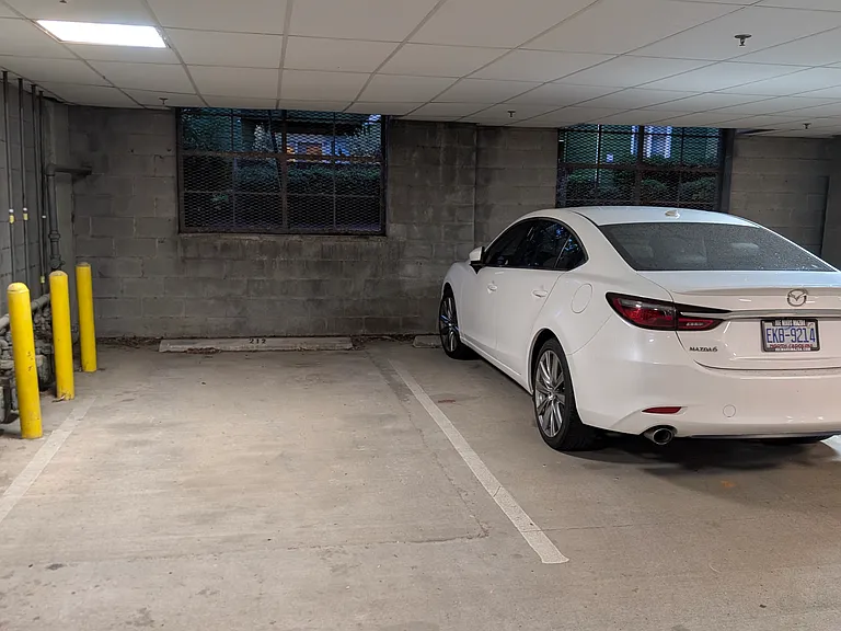 Enclosed protected garage with assigned parking spaces per unit. Space available for tenant storage unit.