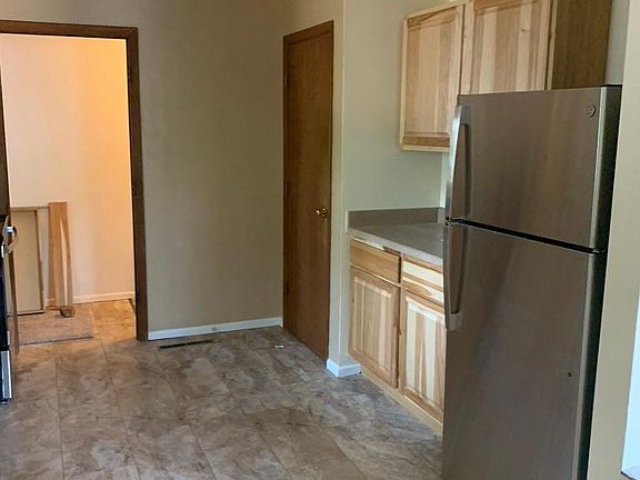 Brand new stainless appliances and hickory cabinets