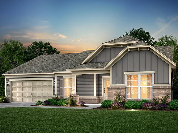 Candler Exterior EC2G features hardie siding, brick, covered porch and 2 car front load garage