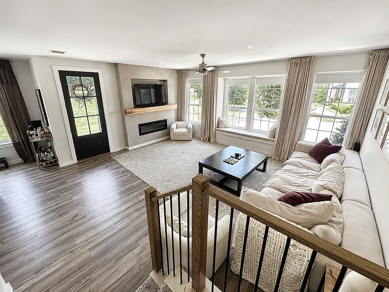 Living room in main floor, view from stair landing