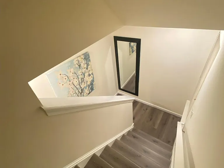 2nd floor stairs going up to the 3rd floor Master suite