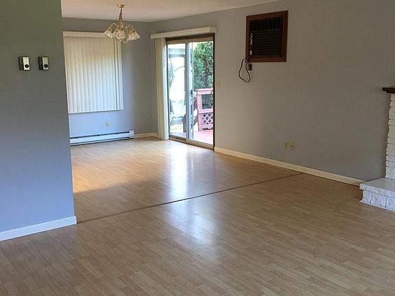 Living room looking into dining area and porch