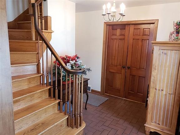 Welcome to your new home at 484 Hartzell School Road.  This grand foyer boasts doors from the original farmhouse which open to a
