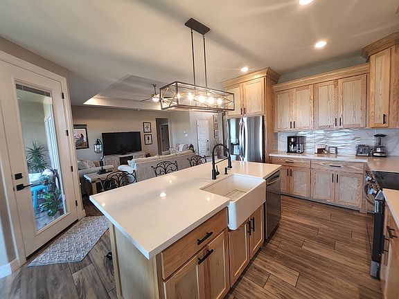 Fully equipped Kitchen for all your cooking needs and living room with 65" tv, GREAT WIFI and Patio area, Lake View throughout home.