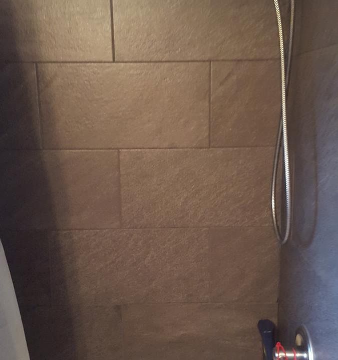 tiled shower in bathroom