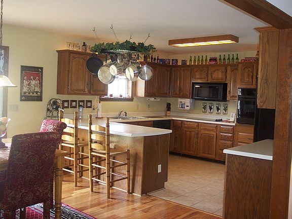 Huge Kitchen w/ lots of cabinets, counterspace & tile floor
