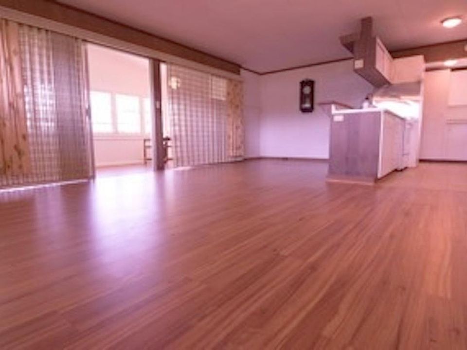 View of dining room, living room, kitchen areas