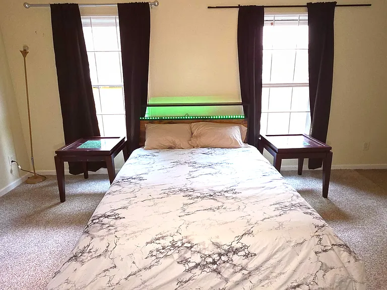 Fully furnished bed room with bed, mattress, walk in closet, extra cupboard, arm chairs, lamp, curtains, computer table/chair and ensuite full bath