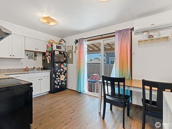 Kitchen opens up to a back patio