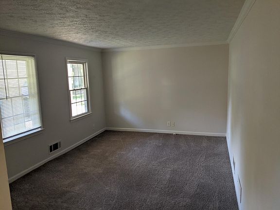 Spacious living room with brand new carpet