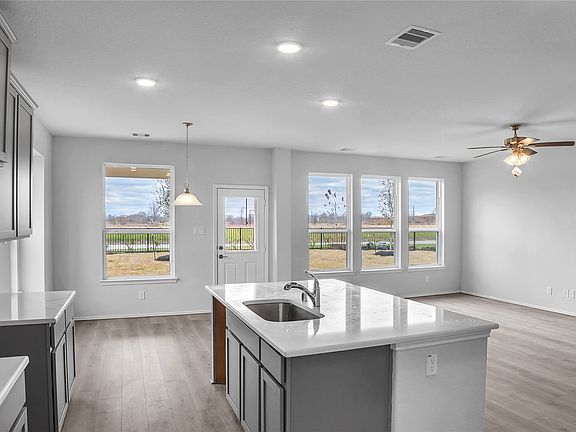 The Princeton- Kitchen into the Family Room- Home under construction. Sample floor plan photo used