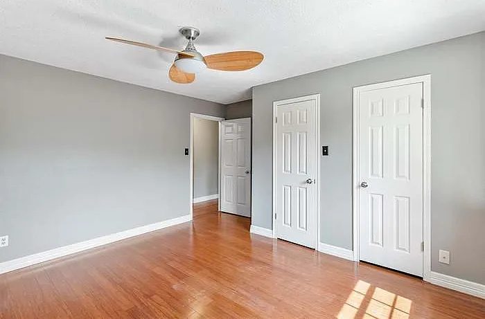 Bedroom 3 with double closets and south-facing window.