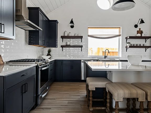 Kitchen with subway tile and island