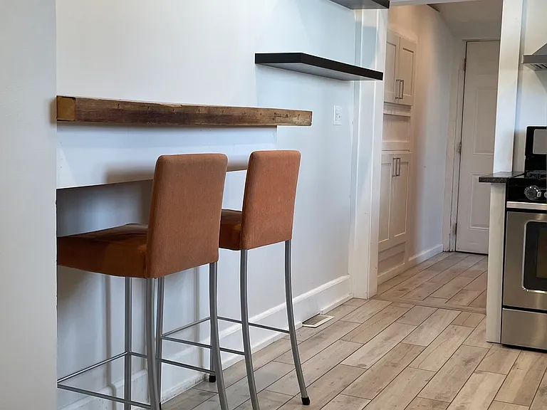 Cozy built-in breakfast bar in the kitchen; perfect for morning coffee, quick meals, homework, or extra prep space.