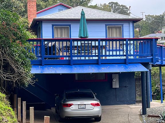 Carport with 2 spaces one for owner and one for renter. House freshly painted.
