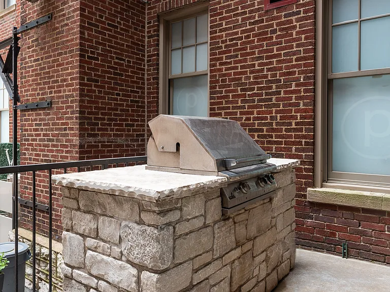 York House quaint courtyard with communal seating and grilling station