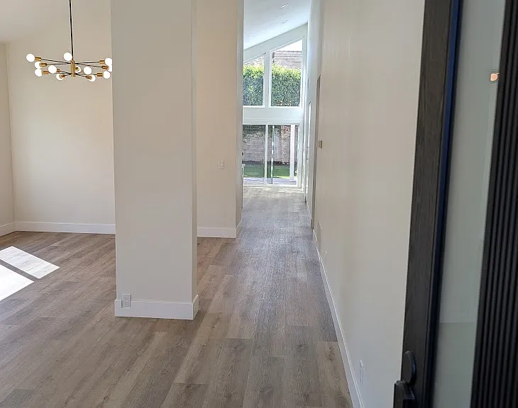 open floor plan, cathedral ceiling throughout the shared space. See from front door out to the backyard