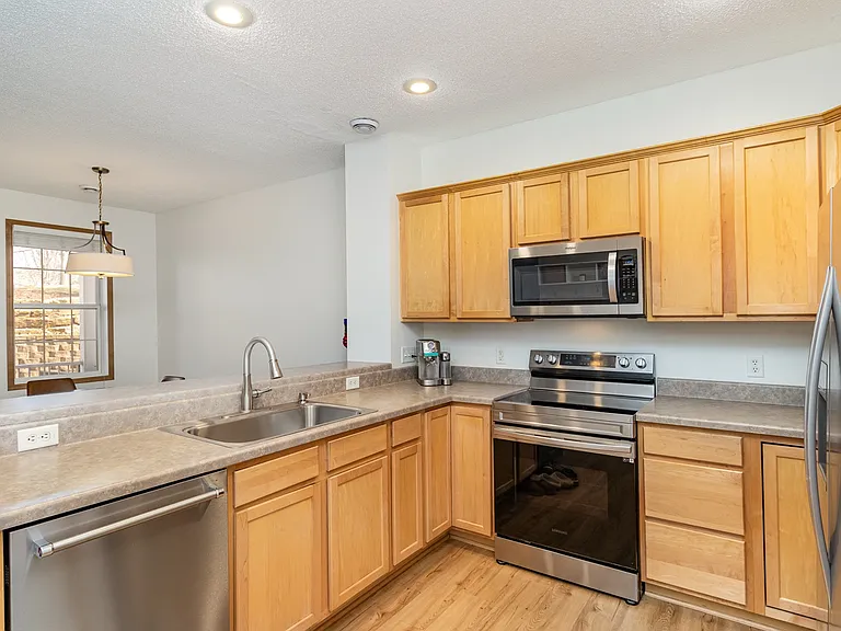 Open concept kitchen overlooking dining and living room