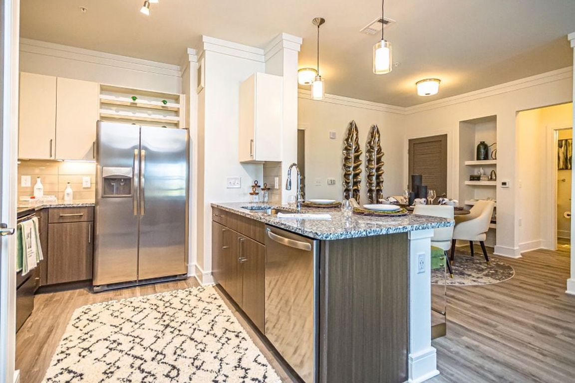 Kitchen and living room with hard surface flooring