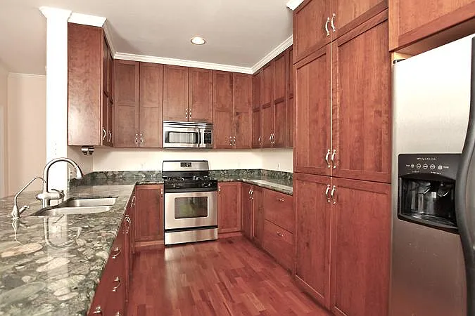 Galley Kitchen, stainless appliances and solid wood cabinets...