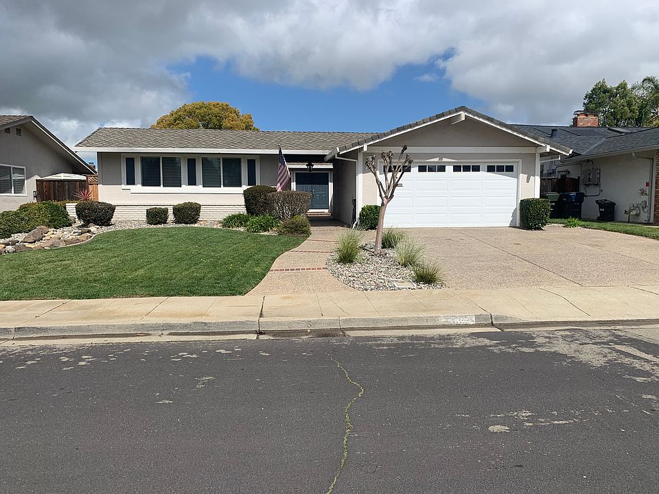 Front of house. Two car garage.