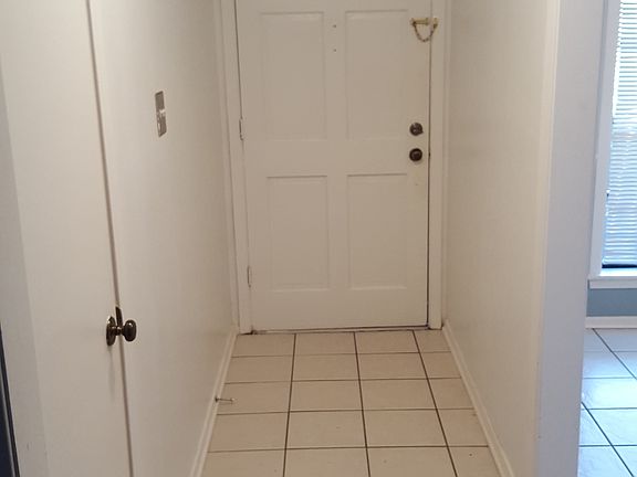 Foyer/coat closet to left