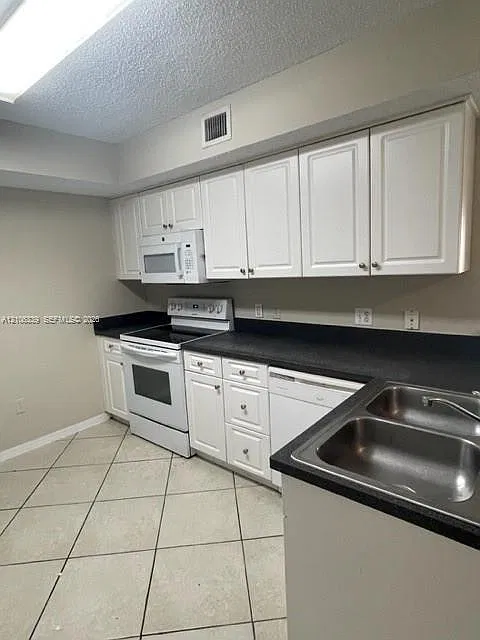 9645 NW 1st Ct — Photo 3