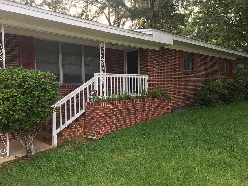 Single car carport with circular drive not shown in photo.