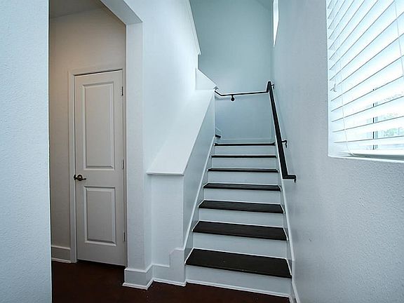Stair Case With Wood Steps & Contemporary Windows.