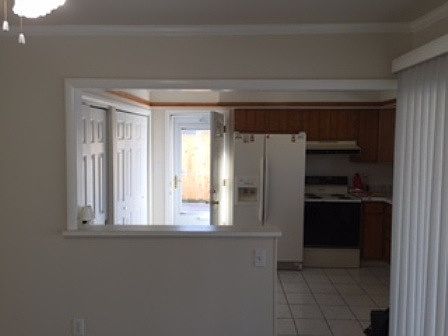 Kitchen with side entrance and washer & dryer