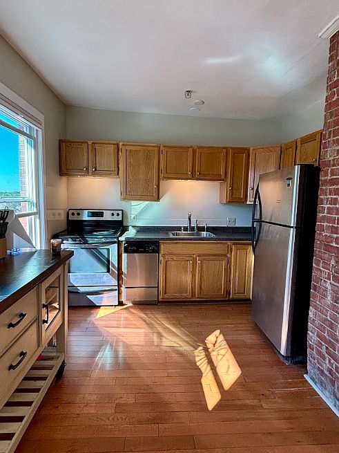 Kitchen has room for a small table! Comes with island counter thing on the left