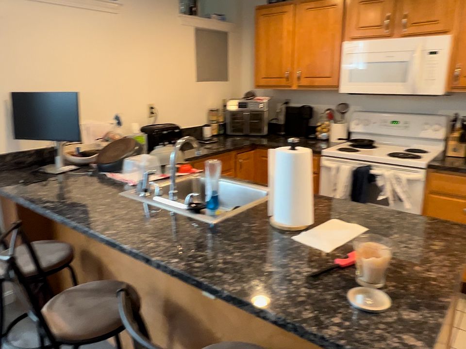 Full kitchen area with space for bar seating