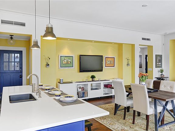 Open concept great room-kitchen with island seating, additional dining space, and your living room! 